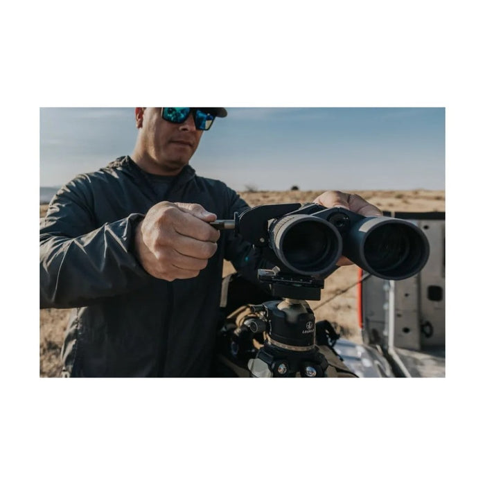 A Man Setting Up the Binocular with Leupold Field Clamp Binocular Tripod Adapter