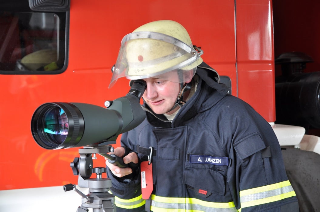 A Man Using Bresser Pirsch 25-75x100mm 45° Zoom Angled Spotting Scope