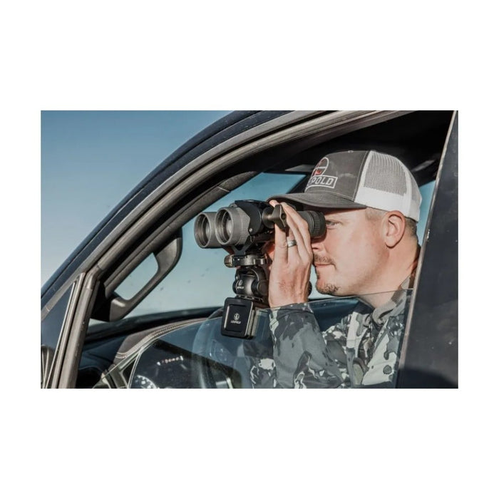 A Man Using a Binocular with Leupold Field Clamp Binocular Tripod Adapter