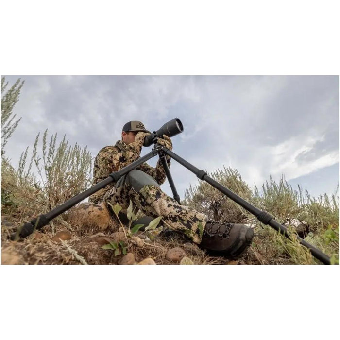 A Man Using Leupold Pro Guide CF-436 Tripod Kit Outdoors