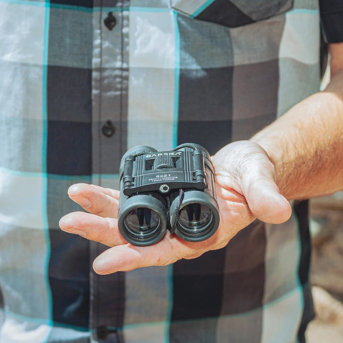 Barska 8x21mm Lucid View Compact Binoculars, 1st Gen - AB10108 on a Palm of Hand