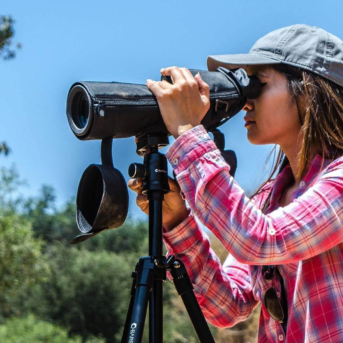 A Woman Using Barska 20-60x65mm WP Level Straight Spotting Scope Outdoors