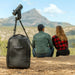 A Couple Sitting with Unistellar Backpack for Odyssey Pro and Odyssey Outdoors