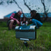 A Family Using the DWARF 3 Smart Telescope Outdoors