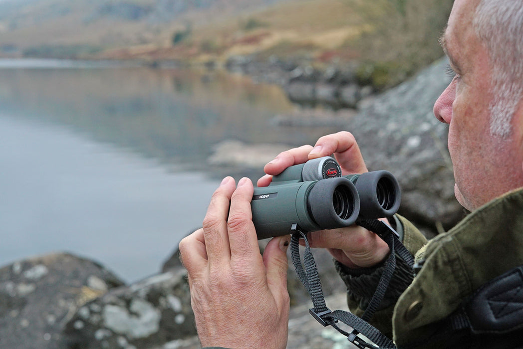 A Man Holding Kowa BDII-XD 8x42mm Prominar Roof Prism Wide Angle Binocular