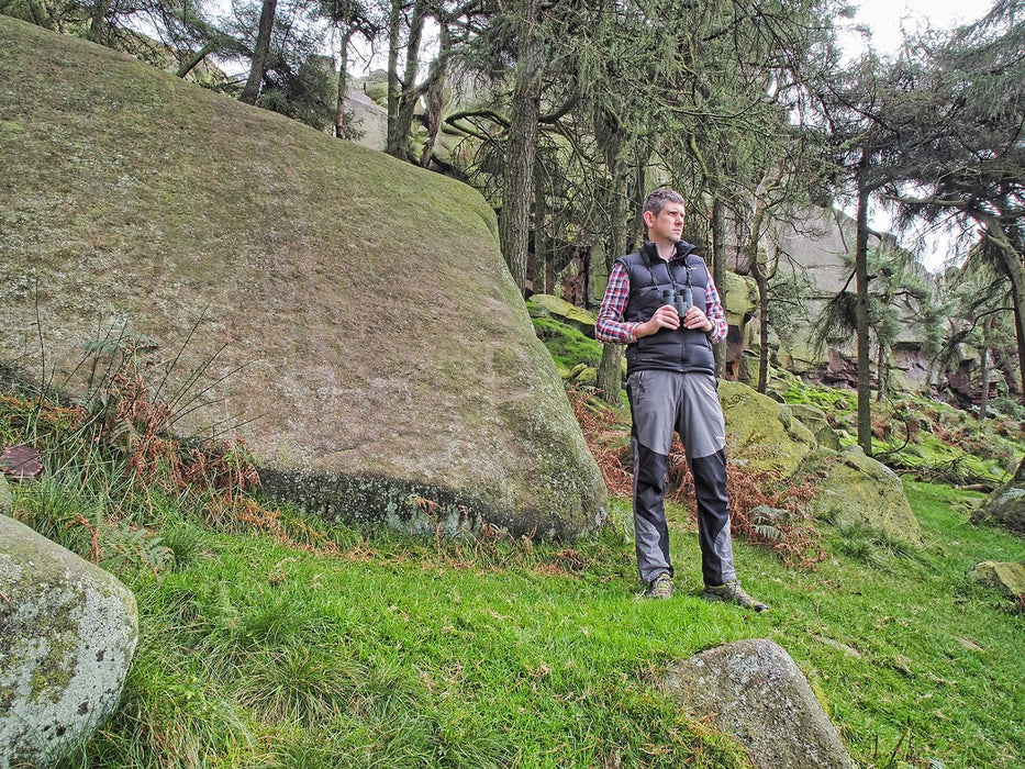 A Man Holding Kowa Genesis 44 8.5x44mm Prominar XD Binocular Outdoors