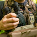 A Man Holding the Alpen Apex Steady 16x30mm HD Binoculars with Image Stabilization Lifestyle Photo