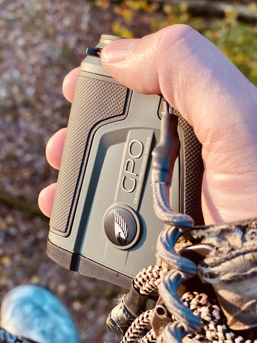 A Man Holding the German Precision Optics Rangetracker 2000 Outdoors