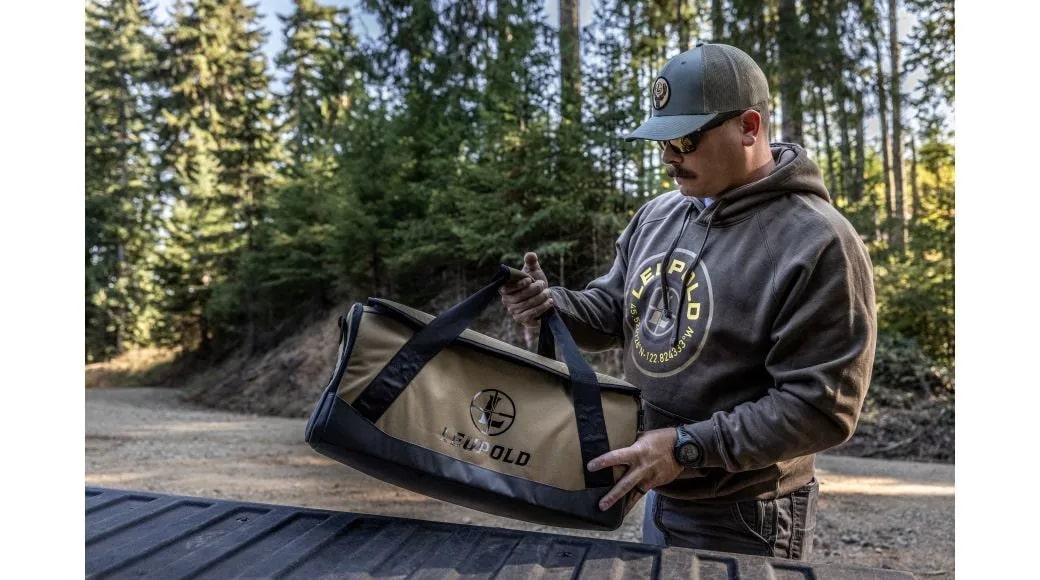 A Man Holding the Leupold Optics Go Gear Duffle Lifestyle Photo