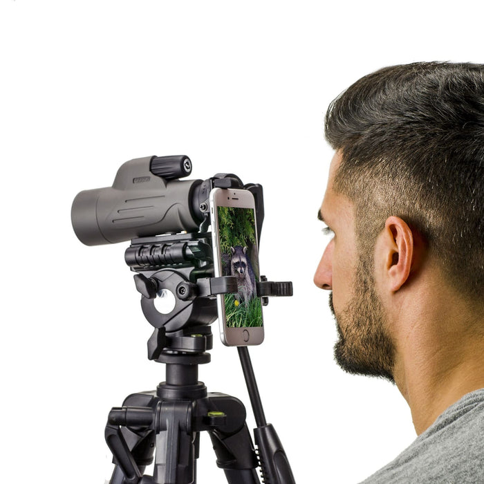 A Man Looking at Carson MonoPix™ 8x42mm Monocular Smartphone Digiscoping Bundle