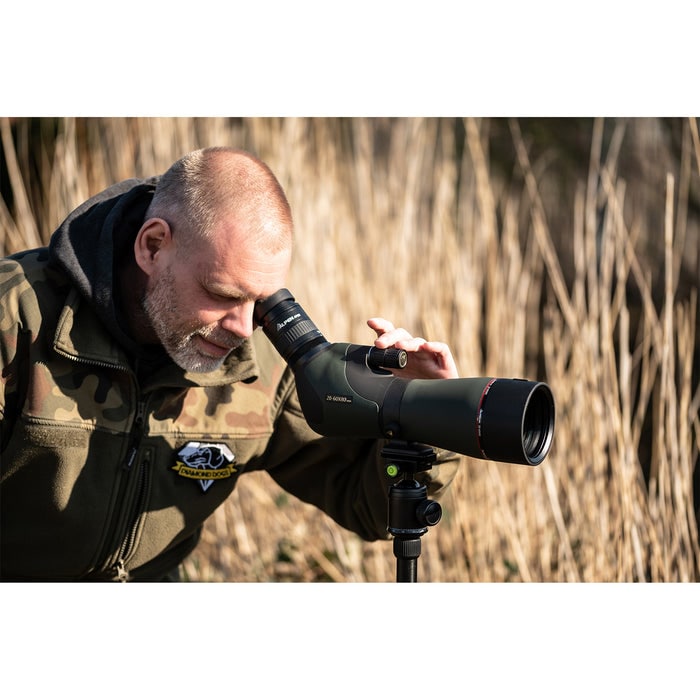 A Man Using Alpen Apex XP 20-60x80mm ED Waterproof Spotting Scope Outdoors