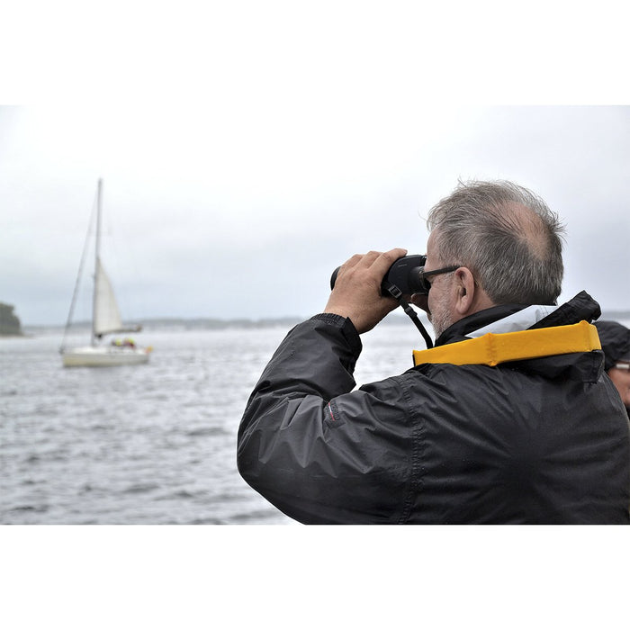 A Man Using Bresser Binocom Nautic 7x50mm GAL Binoculars Outdoors