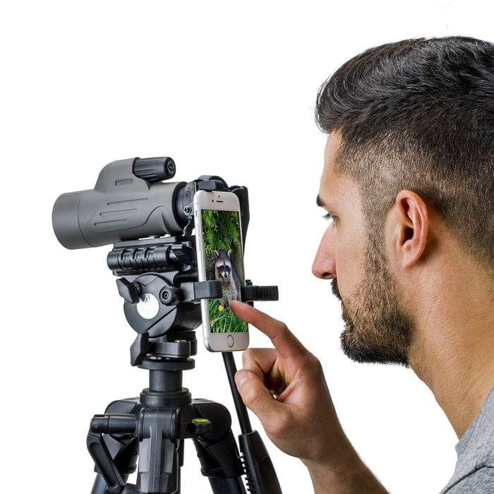 A Man Using Carson MonoPix™ 8x42mm Monocular Smartphone Digiscoping Bundle