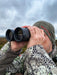 A Man Using German Precision Optics GPO Passion HD 10x50mm Binoculars Outdoors