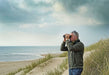 A Man Using Kowa BDII-XD 10x42mm Prominar Roof Prism Wide Angle Binocular