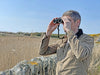 A Man Using Kowa BDII-XD 8x32mm Prominar Roof Prism Wide Angle Binocular