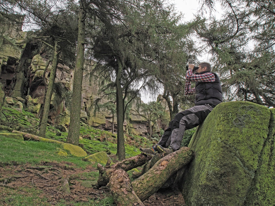 A Man Using Kowa Genesis 44 8.5x44mm Prominar XD Binocular Outdoors