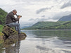 A Man Using Kowa TSN-553 15-45x55mm Angled Spotting Scope Outdoors