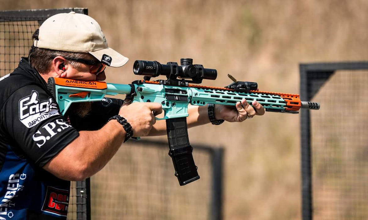 A Man Using a Rifle with German Precision Optics GPOTAC 8X 1-8x24i-mm Illuminated Riflescope