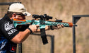 A Man Using a Rifle with German Precision Optics GPOTAC 8X 1-8x24i-mm Illuminated Riflescope