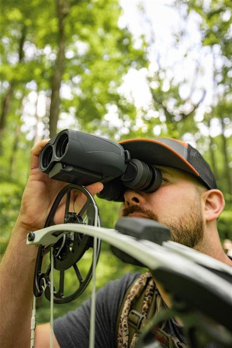A Man Using the Alpen Apex Steady 16x30mm HD Binoculars with Image Stabilization Lifestyle Photo