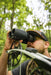 A Man Using the Alpen Apex Steady 16x30mm HD Binoculars with Image Stabilization Lifestyle Photo