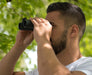 A Man Using the Carson RD Series 8x26mm Binoculars 