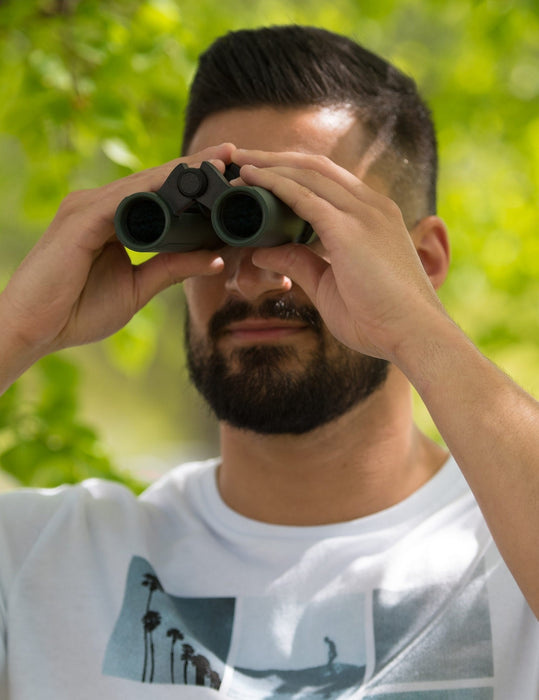 A Man Using the Carson RD Series 8x26mm Binoculars Outdoors