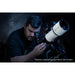 A Man Using the Explore Scientific ED80 Essential Series Air-Spaced Triplet Refractor Telescope with 0.8x Focal Reducer and iEXOS-100-2 PMC-Eight Equatorial Tracker System with WiFi and Bluetooth®
