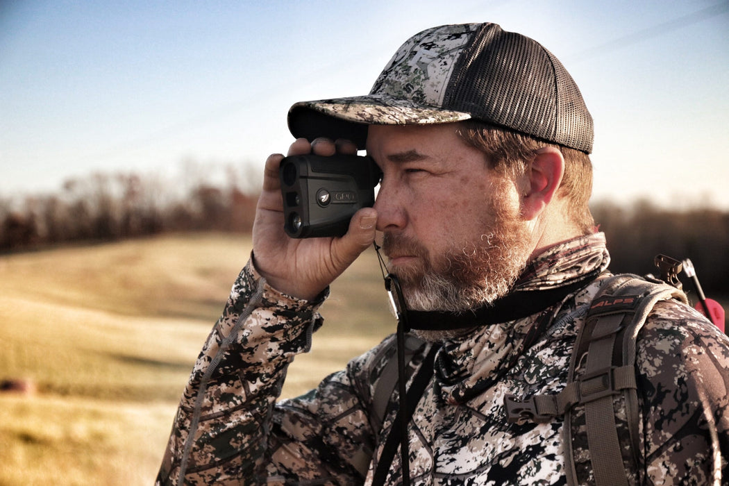A Man Using the German Precision Optics Rangetracker 2000 Outdoors