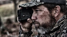 A Man Using the German Precision Optics Rangetracker 2000 Outdoors Focused