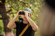 A Man Using the Kite Optics 16x42mm ED APC Stabilized Binoculars - Lifestyle Photo Outdoors