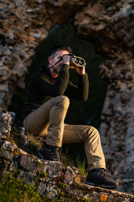 A Man Using the Kite Optics 22x50mm ED APC Stabilized Binoculars - Lifestyle Photo Outdoors