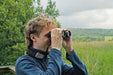 A Man Using the Kowa BD III-XD 10x32mm Binocular - Lifestyle Photo
