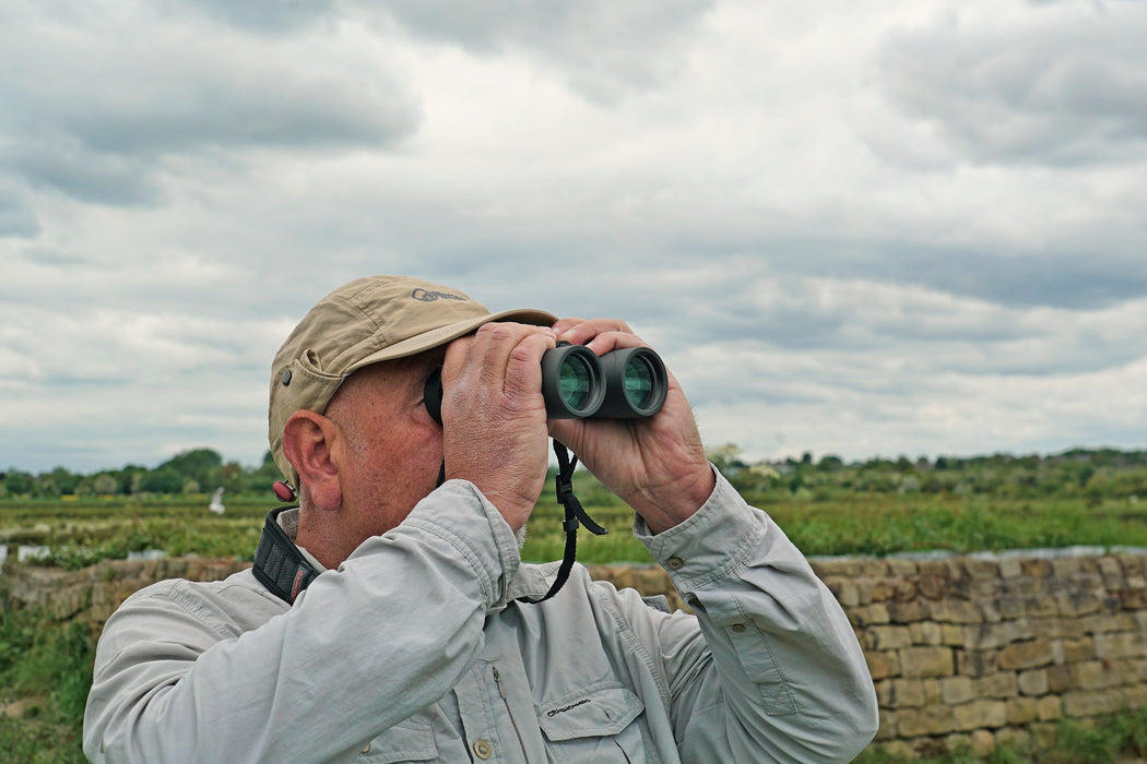 A Man Using the Kowa BD III-XD 8x42mm Binocular - BD III 42-8XD Lifestyle Photo Outdoor