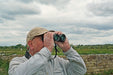 A Man Using the Kowa BD III-XD 8x42mm Binocular - BD III 42-8XD Lifestyle Photo Outdoor