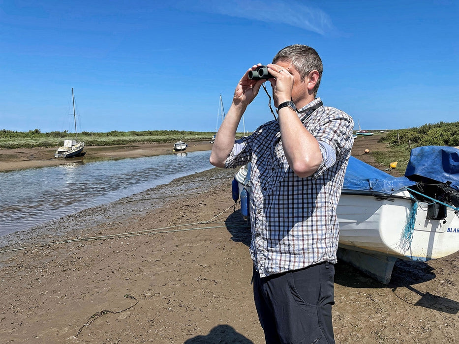 A Man Using the Kowa SV II 8x25mm Binocular 