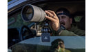 A Man Using the Leupold Optics Window Mount Clamped to Car Window with Spotting Scope