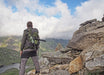 A Man Standing With Kowa TSN-501 20-40x50mm Angled Spotting Scope Outdoors