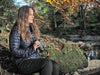 A Woman Holding Kowa Genesis 33 10x33mm Prominar XD Binocular