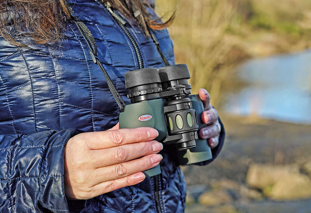 A Woman Holding Kowa YF II 8x30mm Porro Prism Binocular Outdoors
