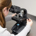 A Woman Using the Carson 40x-1600x Professional Grade Biological Microscope