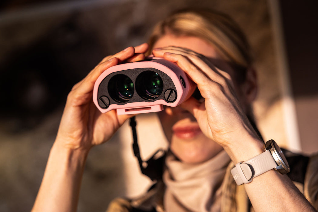 A Woman Using the Kite Optics 10x30mm APC Stabilized II Binoculars - Lifestyle Photo Outdoor