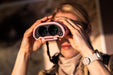 A Woman Using the Kite Optics 10x30mm APC Stabilized II Binoculars - Lifestyle Photo Outdoor