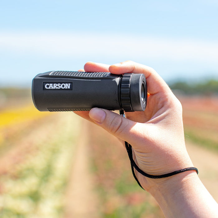 Carson BlackWave™ 10x25mm Monocular Lifestyle Photo On Hand