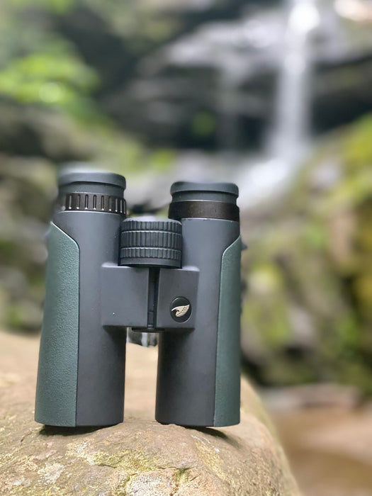 German Precision Optics Passion ED 10×42mm Binoculars Body Standing On Rock Outdoors