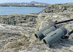 Kowa BDII-XD 8x32mm Prominar Roof Prism Wide Angle Binocular leaning on a rock outdoors