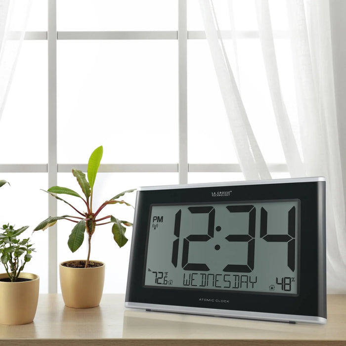 La Crosse Technology 513-05867- INT Jumbo Atomic Wall Clock with Indoor Temp and Humidity Lifestyle Photo on a Table