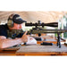 Sightron S6 10-60x56mm ED MOA-BD Bench Rest Riflescope - Bench Rest Shooter Aiming a Rifle with Sightron Riflescope at an Outdoor Shooting Range