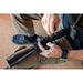 Sightron S6 10-60x56mm ED MOA-BD Bench Rest Riflescope - Shooter Adjusting a Sightron Riflescope Mounted on a Bench Rest Rifle